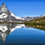 kisscc0-matterhorn-swiss-alps-gornergrat-stellisee-mountai-surreal-swiss-mountain-lake-5b75cbe22bdfc7.5467418715344465621797
