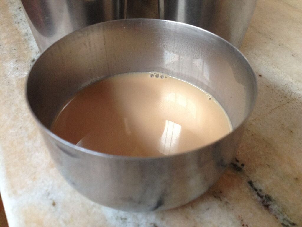 Doodh patti tea brewing in a steel pot