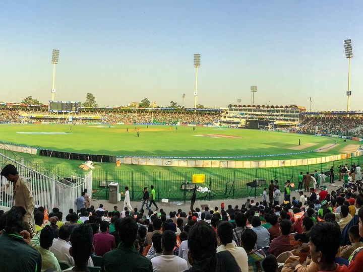 Spectators at a floodlit match in Gaddafi Stadium, Lahore