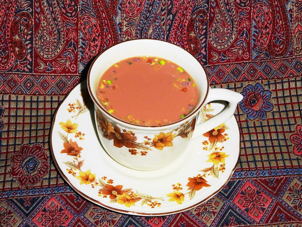 Pink Kashmiri chai in a floral teacup